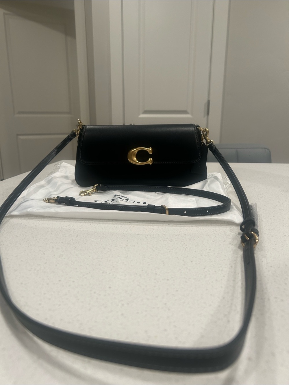 Coach Black Leather Crossbody with Gold 'C' Accent